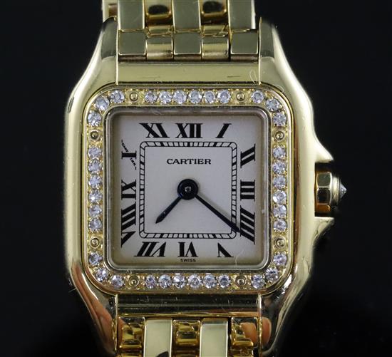 A ladys modern 18ct gold and diamond Cartier Panthere quartz wrist watch,